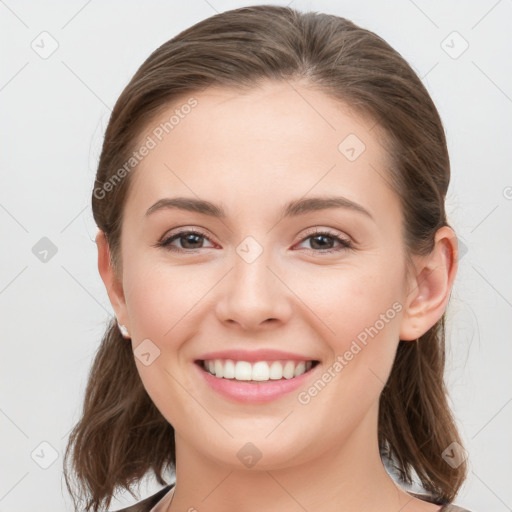 Joyful white young-adult female with medium  brown hair and grey eyes