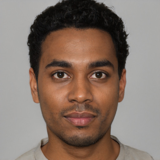 Neutral black young-adult male with short  black hair and brown eyes