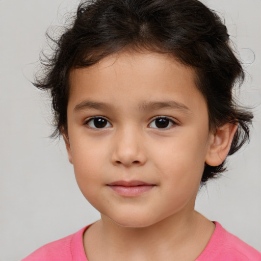 Joyful white child female with medium  brown hair and brown eyes