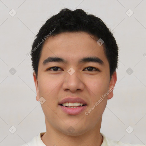 Joyful asian young-adult male with short  black hair and brown eyes