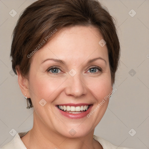 Joyful white adult female with short  brown hair and grey eyes