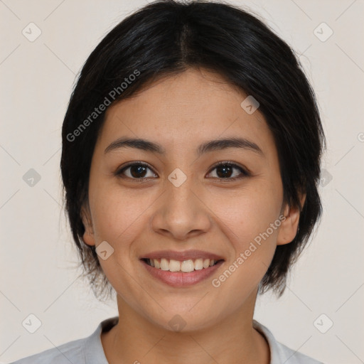 Joyful asian young-adult female with medium  black hair and brown eyes