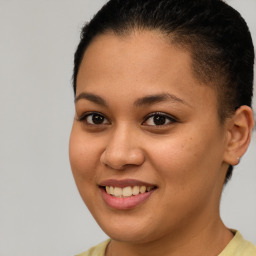 Joyful latino young-adult female with short  brown hair and brown eyes