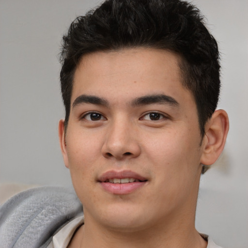Joyful asian young-adult male with short  brown hair and brown eyes
