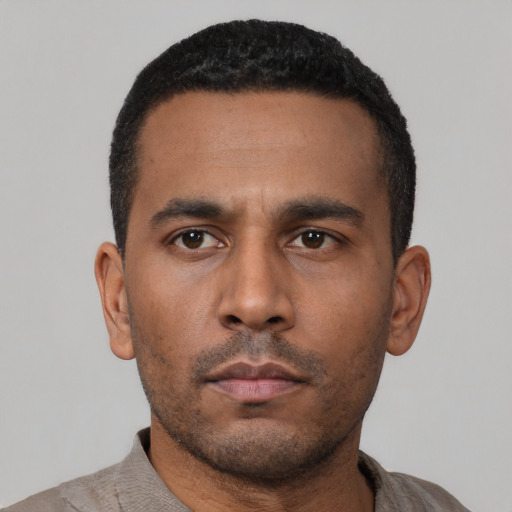 Neutral latino young-adult male with short  black hair and brown eyes