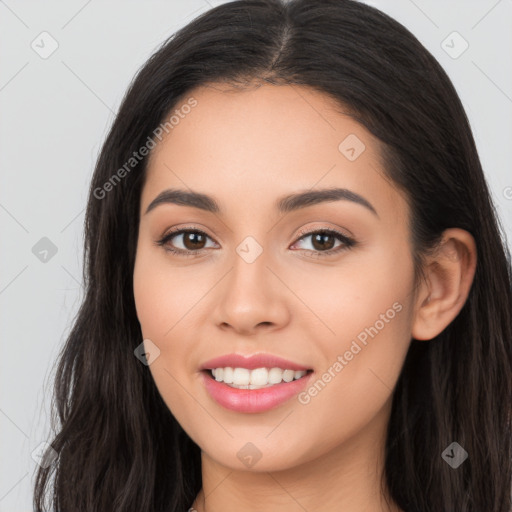 Joyful latino young-adult female with long  brown hair and brown eyes