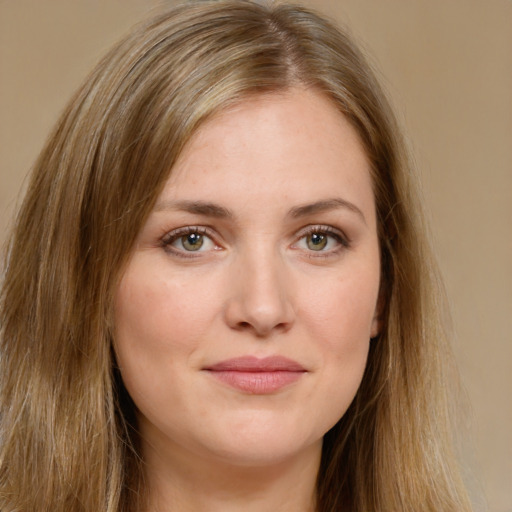 Joyful white young-adult female with long  brown hair and green eyes