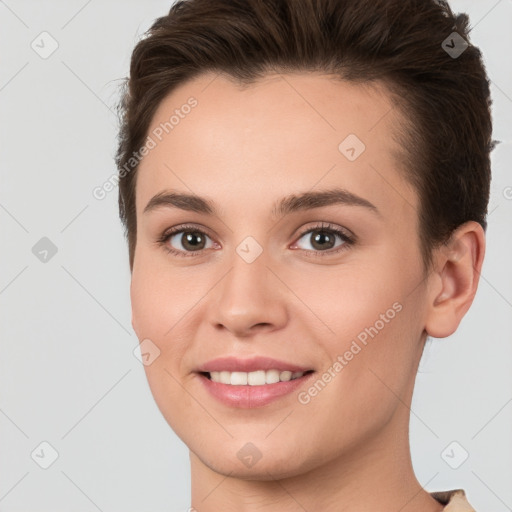 Joyful white young-adult female with short  brown hair and brown eyes