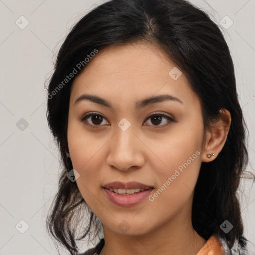 Joyful latino young-adult female with medium  brown hair and brown eyes