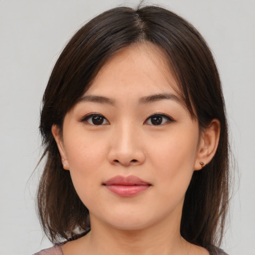 Neutral asian young-adult female with medium  brown hair and brown eyes