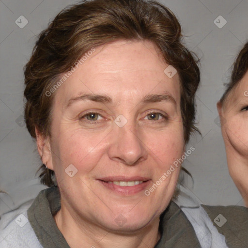 Joyful white adult female with medium  brown hair and blue eyes