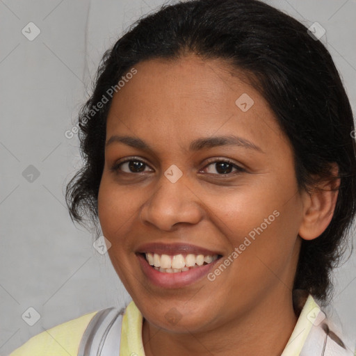 Joyful latino young-adult female with medium  brown hair and brown eyes