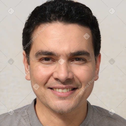 Joyful white young-adult male with short  black hair and brown eyes