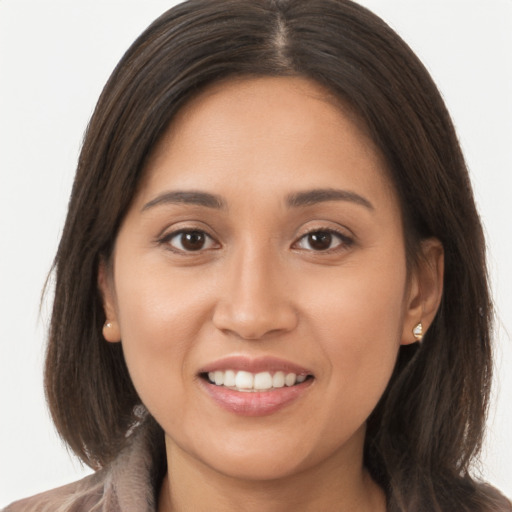 Joyful white young-adult female with long  brown hair and brown eyes