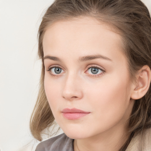 Neutral white young-adult female with long  brown hair and blue eyes