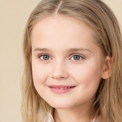 Joyful white child female with long  brown hair and brown eyes