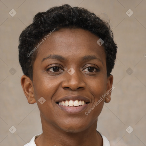 Joyful black young-adult female with short  brown hair and brown eyes