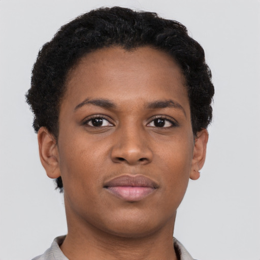 Joyful black young-adult female with short  brown hair and brown eyes