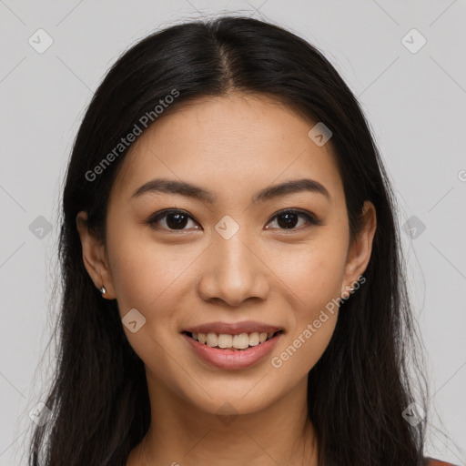 Joyful latino young-adult female with long  brown hair and brown eyes