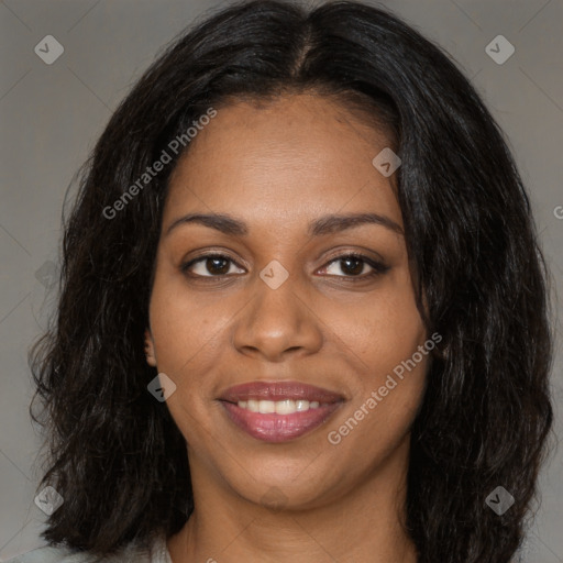 Joyful black young-adult female with long  brown hair and brown eyes