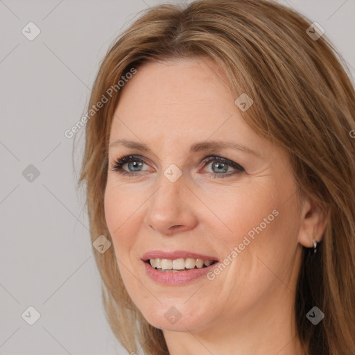 Joyful white adult female with medium  brown hair and brown eyes