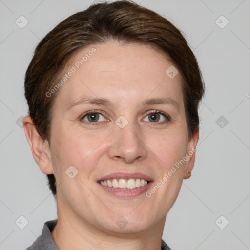 Joyful white adult female with short  brown hair and grey eyes