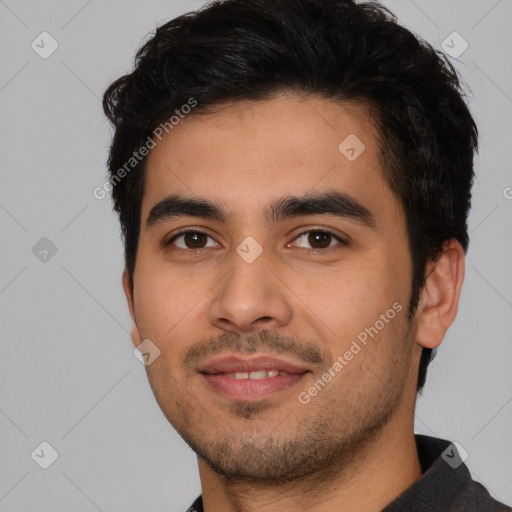 Joyful latino young-adult male with short  black hair and brown eyes