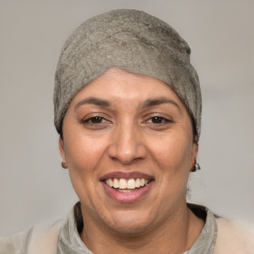 Joyful white adult female with short  black hair and brown eyes