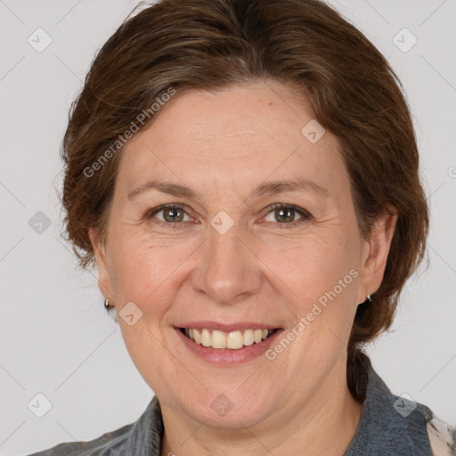 Joyful white adult female with medium  brown hair and grey eyes