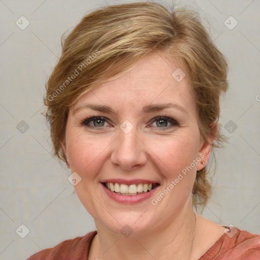 Joyful white young-adult female with medium  brown hair and blue eyes