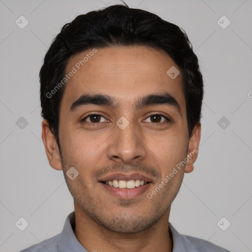 Joyful white young-adult male with short  black hair and brown eyes