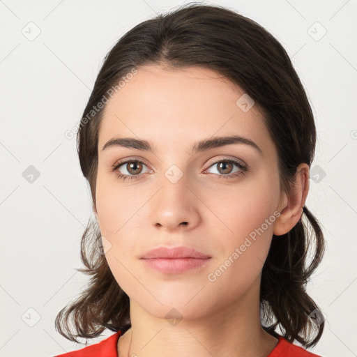 Neutral white young-adult female with medium  brown hair and brown eyes