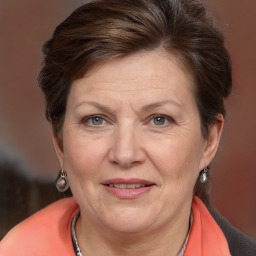 Joyful white adult female with short  brown hair and brown eyes