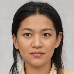 Joyful asian young-adult female with medium  brown hair and brown eyes