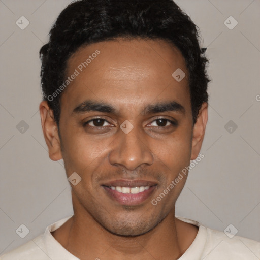 Joyful black young-adult male with short  black hair and brown eyes