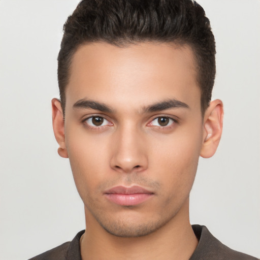 Neutral latino young-adult male with short  brown hair and brown eyes