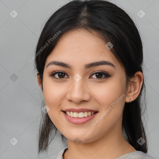 Joyful latino young-adult female with medium  brown hair and brown eyes