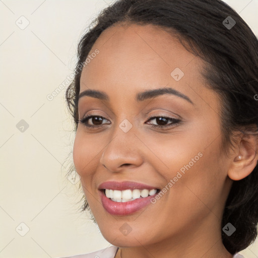 Joyful latino young-adult female with long  brown hair and brown eyes