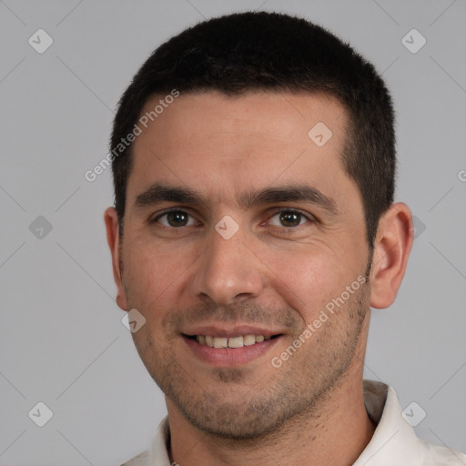 Joyful white young-adult male with short  brown hair and brown eyes