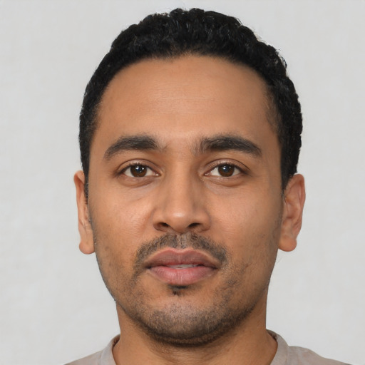 Neutral latino young-adult male with short  black hair and brown eyes