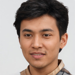 Joyful asian young-adult male with short  brown hair and brown eyes