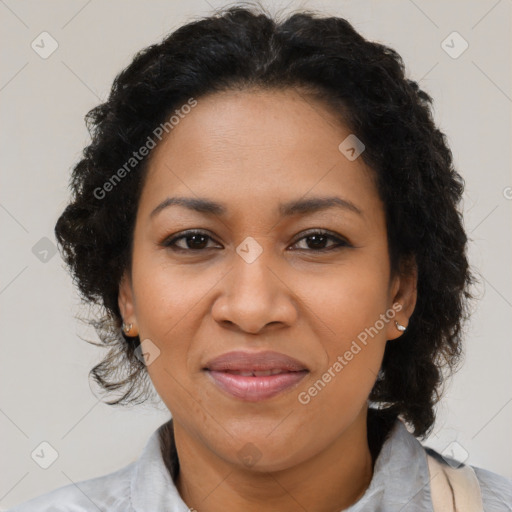 Joyful latino adult female with medium  brown hair and brown eyes