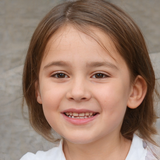 Joyful white child female with medium  brown hair and brown eyes