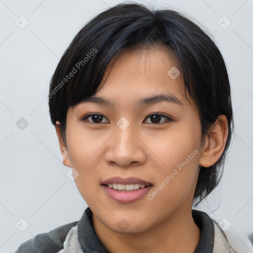 Joyful asian young-adult female with medium  black hair and brown eyes