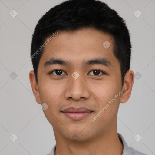 Joyful asian young-adult male with short  black hair and brown eyes