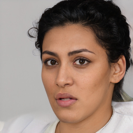 Neutral latino young-adult female with short  brown hair and brown eyes