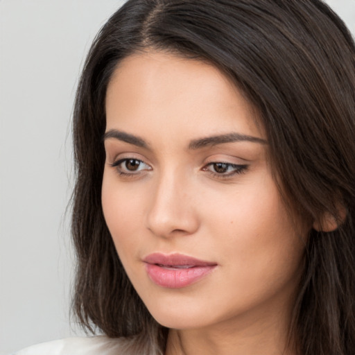 Neutral white young-adult female with long  brown hair and brown eyes