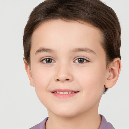 Joyful white child female with short  brown hair and brown eyes