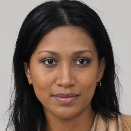 Joyful asian young-adult female with long  brown hair and brown eyes