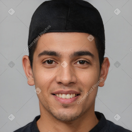 Joyful white young-adult male with short  black hair and brown eyes